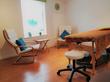 Treatment room to rent in Old Town, Swindon SN1 with massage table, wood floors & comfortable chairs for talking therapy