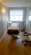 Treatment room to rent in Richmond clinic in TW9 with massage bed or beauty couch & wooden floor, in London UK