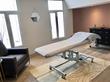 Beautiful treatment Room in Twickenham Wellness Centre with massage table treatment couch, stylish elegant modern contemporary interior design decor