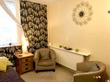 Therapy room to rent in Cheltenham GL50 in Award Winning Therapy Centre, with therapist armchairs, treatment bed couch & floral wallpaper