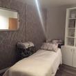Beauty Therapy room for hire in Cobham KT11, with massage treatment table and feminine wallpaper in Wellbeing & Beauty Salon