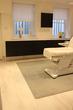 Large & spacious Harley Street Beauty Room in London with treatment couch & professional clean modern contemporary interior design decor
