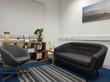Therapy room to rent in Kingsbury London NW9 with stylish sofa, therapist armchair & modern contemporary interior design