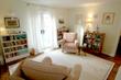 Large & spacious Talking therapy room to rent in Acton / Shepherds Bush W3 with pink & white decor & colourful rainbow bookshelf