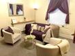 Beautiful therapy room to rent in Cheltenham therapy centre GL50 with purple sofa, therapist armchair & stylish luxury interior design decor