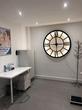 Clinic Consulting Treatment room to rent in  Festival Retail Park Stoke on Trent ST1, with consultation desk and large clock decor