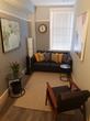 Ealing Broadway Counselling Therapy Room to Rent with beautiful modern decor, stylish art, comfy sofa & chair, in London W5