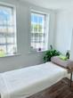 Hull Treatment room with massage table and lots of natural light in complementary & alternative therapist clinic