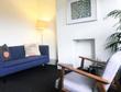 Talking Therapy Room to Rent on Shoreditch High Street, London, E1 with contemporary interior design, sofa & armchair