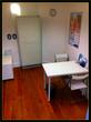 consulting room to rent in Wilmslow clinic with little consultation desk table & chairs