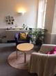 Talking Therapy room to rent in Bristol BS1 with purple therapist armchair & pink client chair in cosy homey space