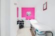 Bright clean beauty treatment room to rent in Highgate, Hampstead Lane, North London N6 with white and pink decor & beauty couch bed or massage table