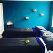 Headingley Leeds Treatment Room with Blue Walls and two massage tables or treatment couches for massage therapist and couples massage