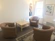 Marylebone therapy room to rent for a London therapist, counsellor or psychotherapist, with brown armchairs, rug & window