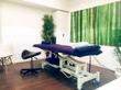 Bridge Street M3 Manchester Treatment room for rent with electric bed massage table or beauty couch & green bamboo wall art